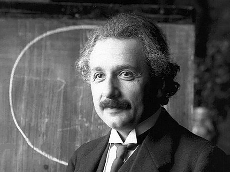 Albert Einstein in front of a blackboard. Albert Einstein in front of a blackboard.
